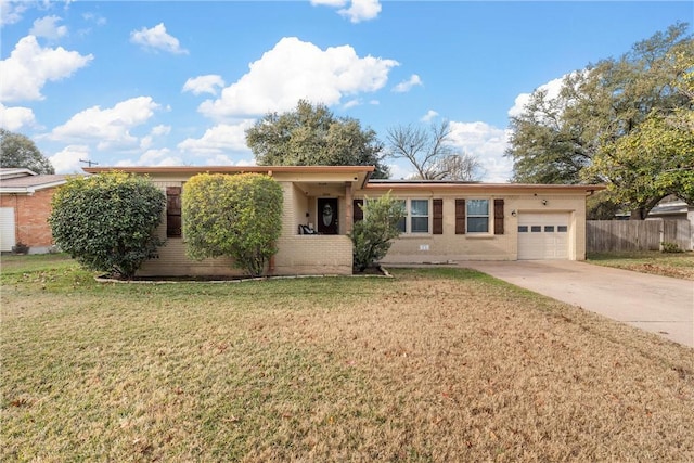 single story home featuring a garage and a front lawn