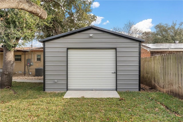 view of outbuilding with central AC and a yard