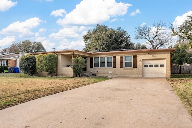 ranch-style house with a garage and a front lawn