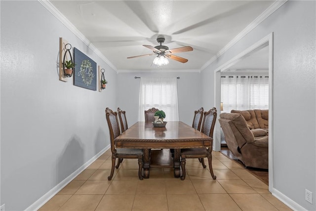 tiled dining area with ornamental molding and ceiling fan