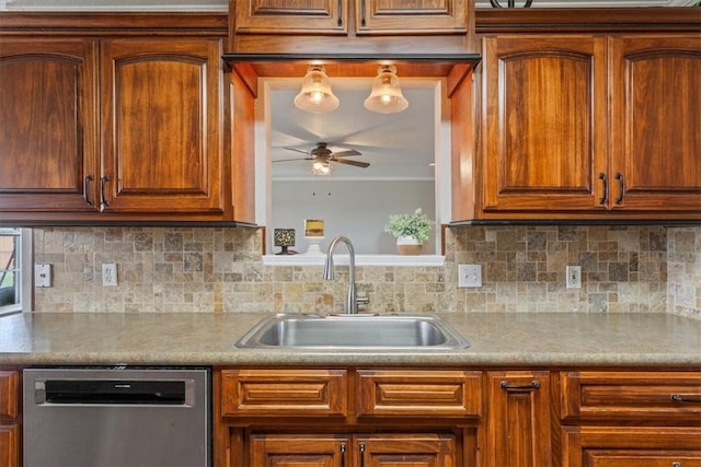 kitchen with brown cabinets, a sink, backsplash, dishwasher, and ceiling fan