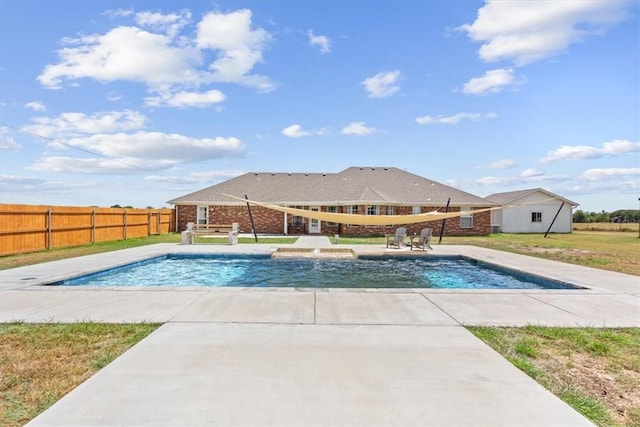 view of pool featuring a fenced backyard, a fenced in pool, a yard, and a patio