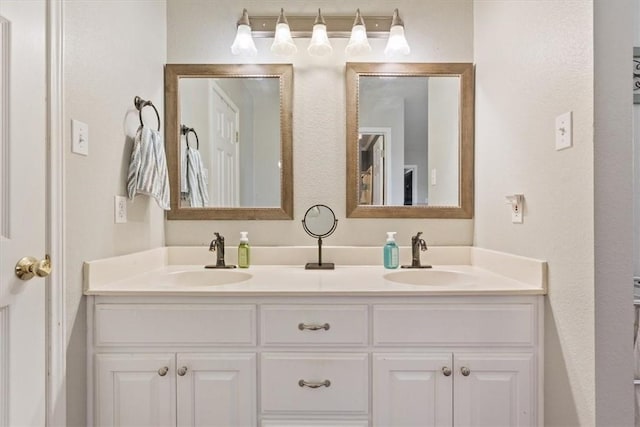 bathroom with double vanity and a sink