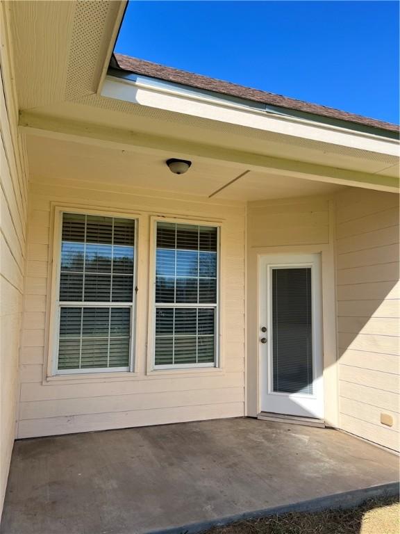 doorway to property featuring a patio