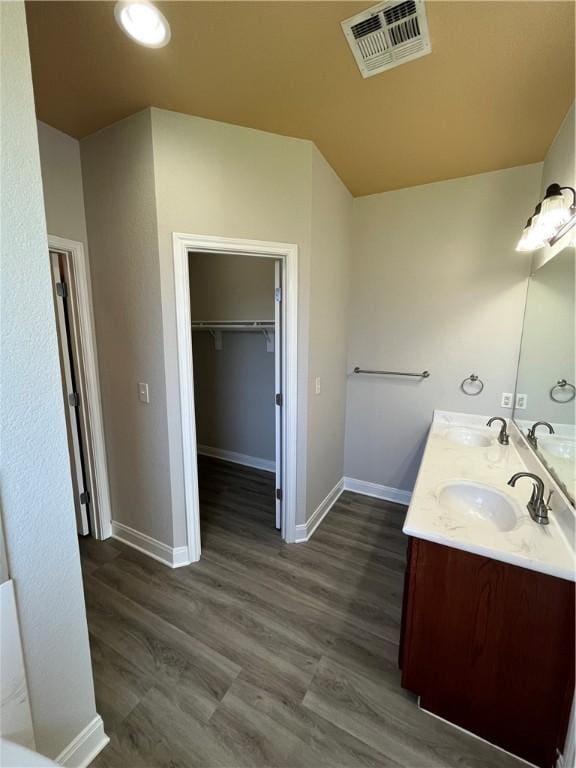 bathroom featuring hardwood / wood-style floors and vanity