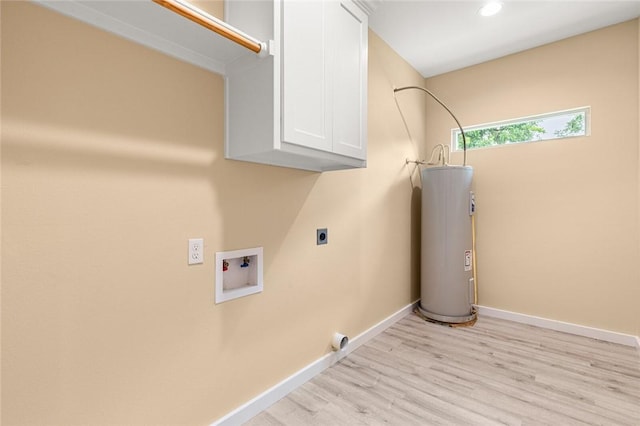 clothes washing area with cabinets, washer hookup, light wood-type flooring, hookup for an electric dryer, and water heater