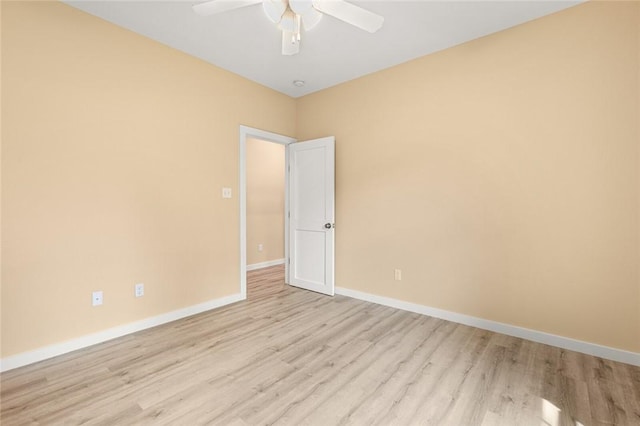 spare room featuring ceiling fan and light hardwood / wood-style floors