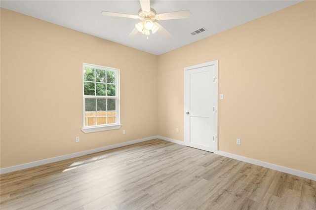 unfurnished room with ceiling fan and light wood-type flooring