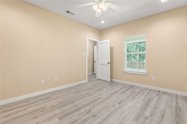 spare room with ceiling fan and light hardwood / wood-style flooring