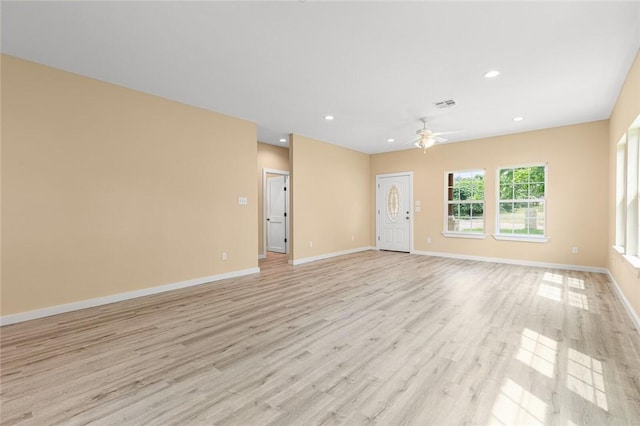 unfurnished living room featuring light hardwood / wood-style floors and ceiling fan