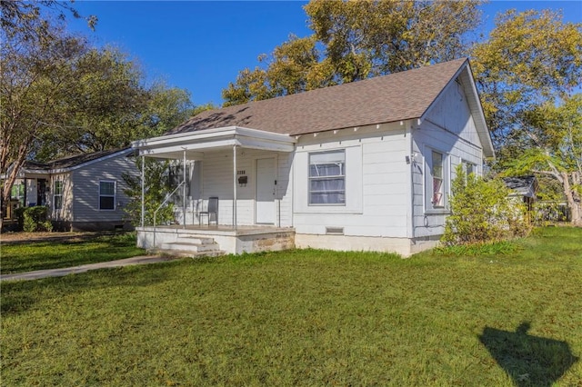 view of front facade with covered porch and a front yard