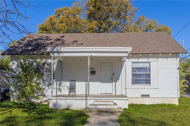 view of front of house with a front lawn and a porch