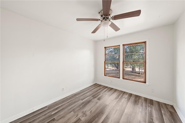 unfurnished room featuring ceiling fan and light wood-type flooring