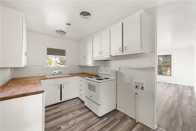 kitchen with white range with electric cooktop, white cabinetry, sink, and light hardwood / wood-style flooring