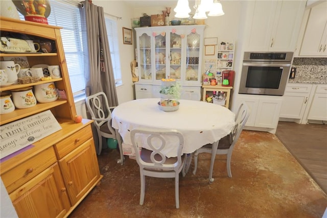 dining area with a notable chandelier