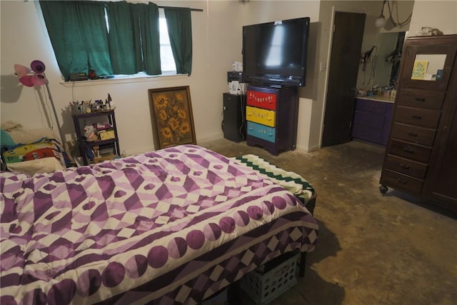 bedroom with concrete flooring