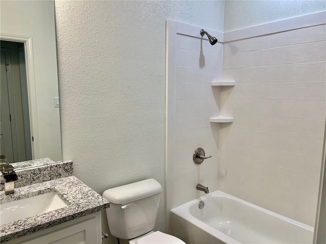 full bathroom featuring toilet, tiled shower / bath combo, and vanity