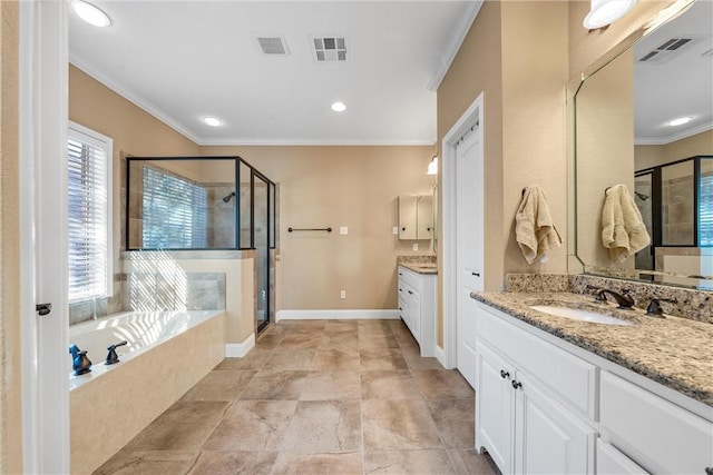 bathroom featuring crown molding, separate shower and tub, and vanity