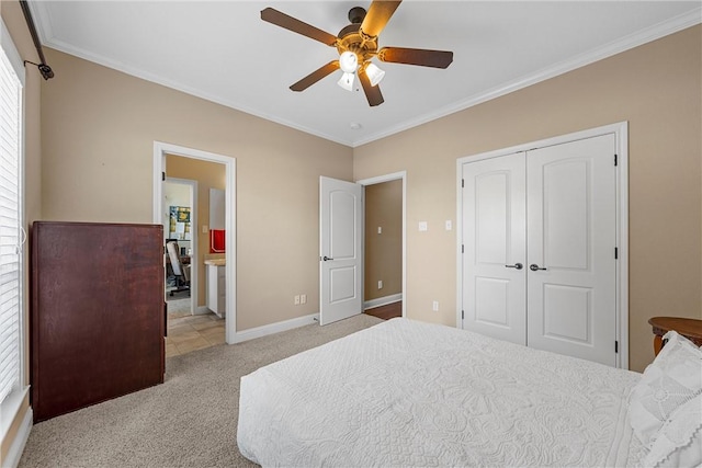 bedroom with ceiling fan, light colored carpet, a closet, and crown molding