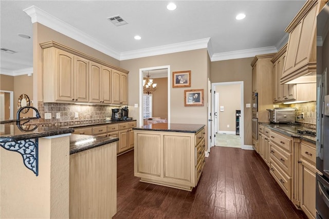 kitchen featuring a notable chandelier, ornamental molding, tasteful backsplash, and light brown cabinets