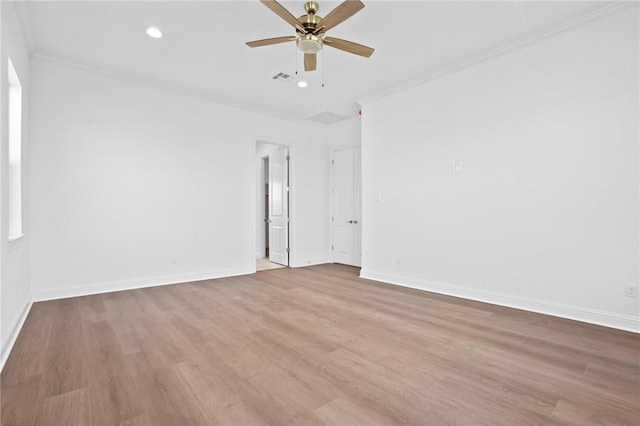 empty room with ceiling fan, ornamental molding, and light hardwood / wood-style flooring