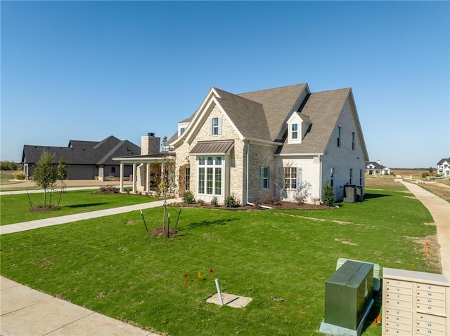 view of front of house with a front lawn and cooling unit