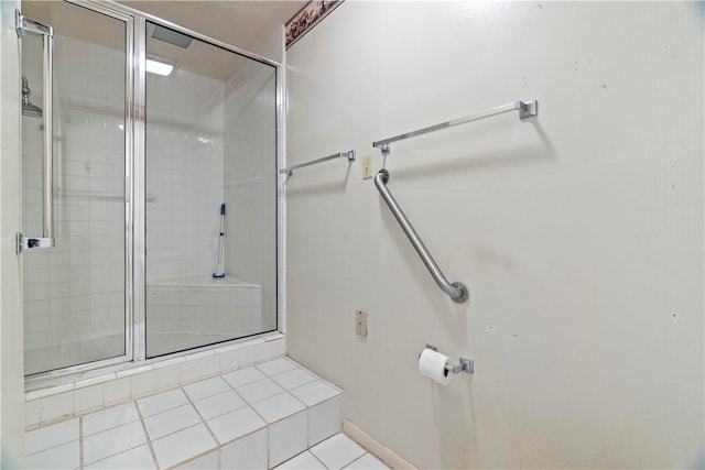 bathroom featuring tile patterned floors and walk in shower