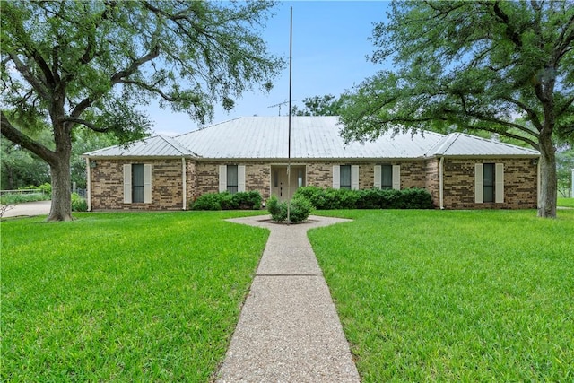 ranch-style house with a front lawn