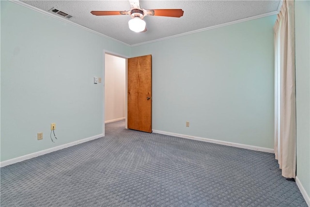 empty room featuring carpet flooring, a textured ceiling, and ornamental molding