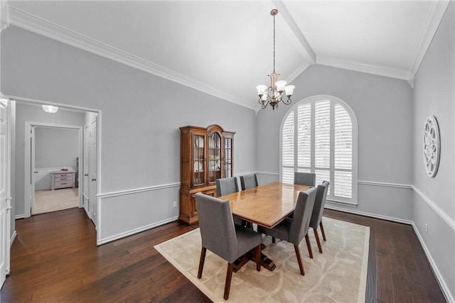 dining room featuring crown molding, dark hardwood / wood-style flooring, vaulted ceiling, and a notable chandelier