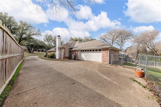 view of side of property with a garage