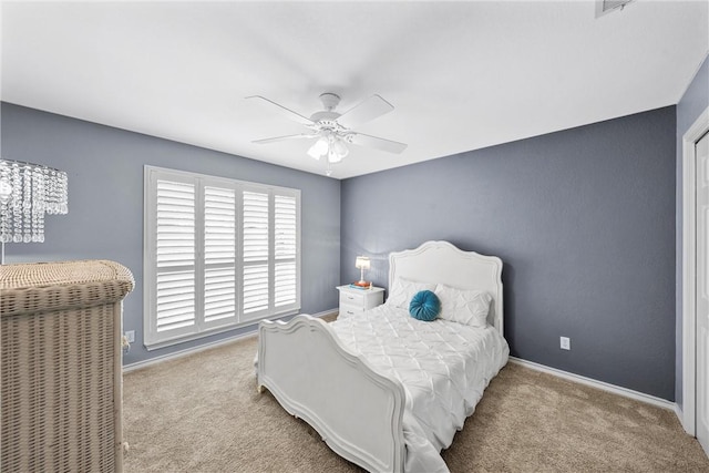 carpeted bedroom with ceiling fan