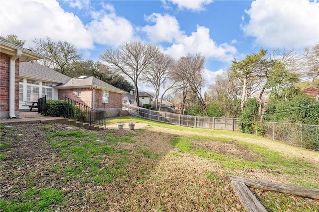 view of yard with a fire pit