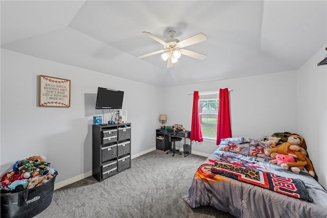 carpeted bedroom with ceiling fan and vaulted ceiling