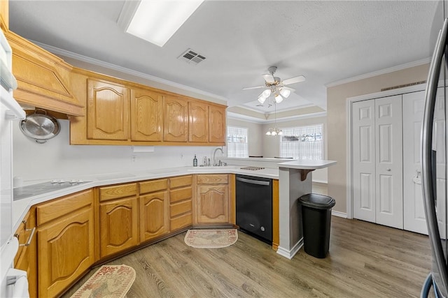 kitchen featuring light wood-type flooring, black dishwasher, kitchen peninsula, and ornamental molding