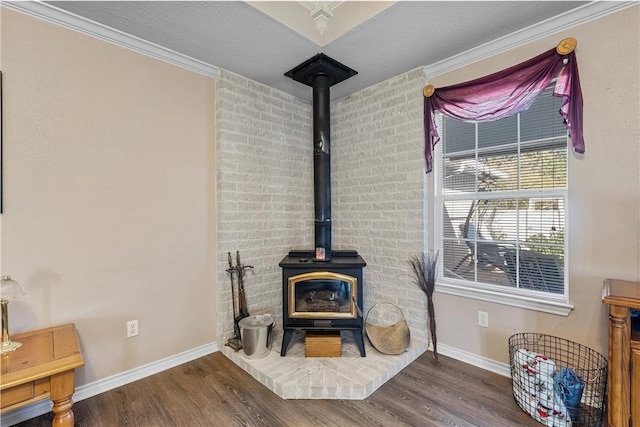 interior details with hardwood / wood-style floors, a wood stove, crown molding, and a textured ceiling