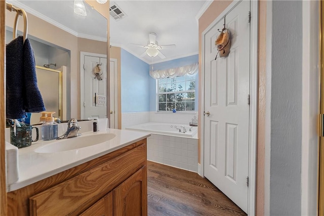 bathroom featuring vanity, crown molding, hardwood / wood-style flooring, ceiling fan, and shower with separate bathtub