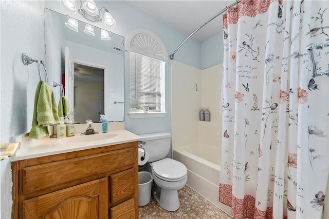 full bathroom featuring vanity, shower / tub combo, and toilet