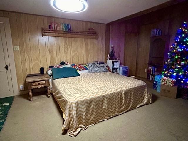 bedroom with wood walls