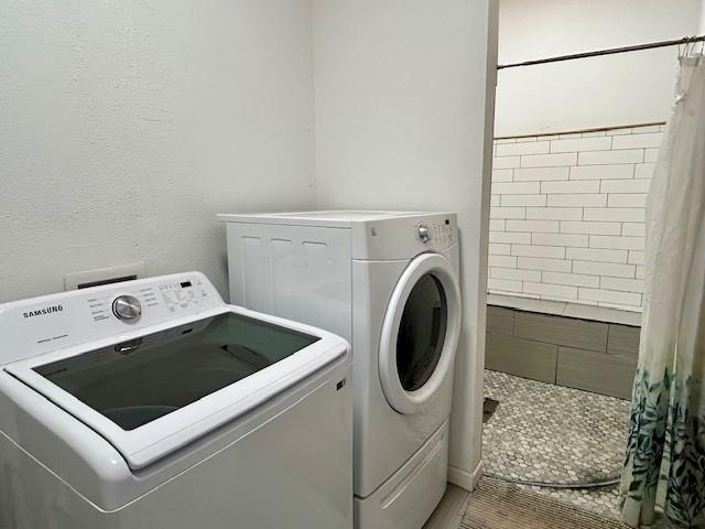 laundry room with washer and clothes dryer