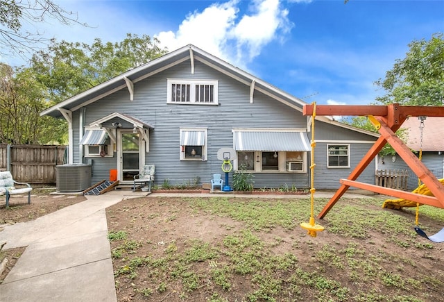 rear view of property featuring cooling unit