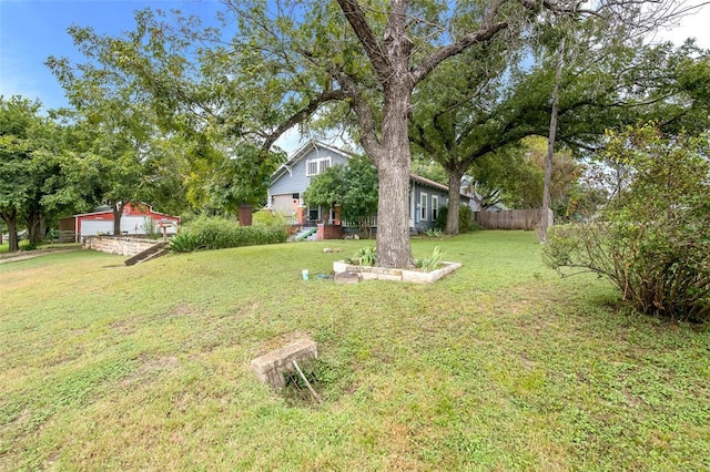 view of yard with an outbuilding and a garage