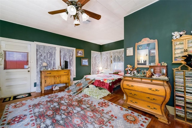 bedroom featuring hardwood / wood-style flooring and ceiling fan