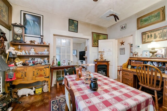 dining area featuring dark hardwood / wood-style flooring and ceiling fan