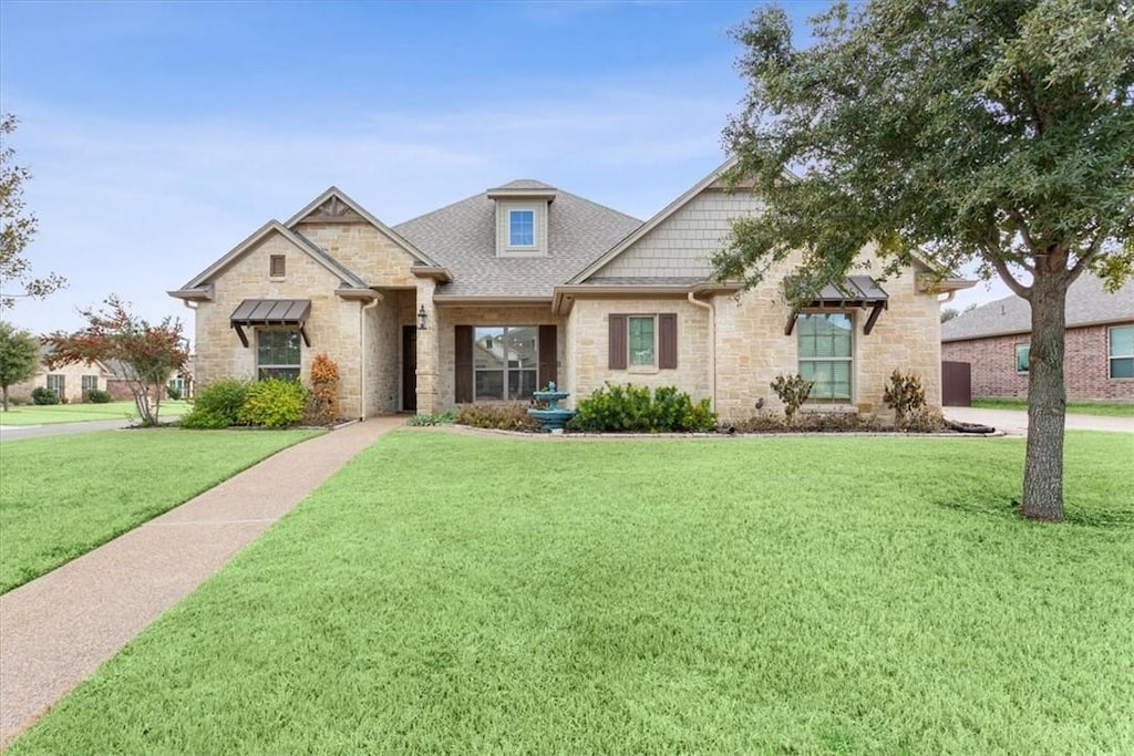 view of front of property with a front lawn