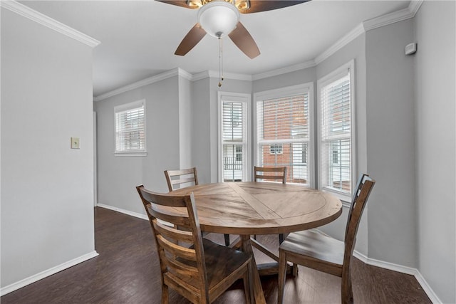 dining area with crown molding, baseboards, dark wood-type flooring, and a ceiling fan