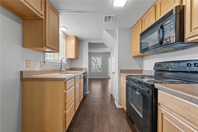 kitchen featuring visible vents, light brown cabinets, dark wood finished floors, black appliances, and a sink