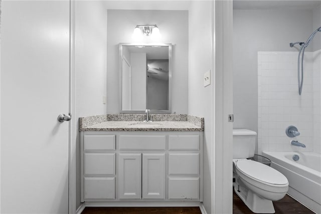 full bath featuring vanity, toilet, and shower / bath combination