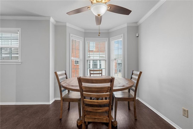 dining area featuring a wealth of natural light, dark wood finished floors, and crown molding