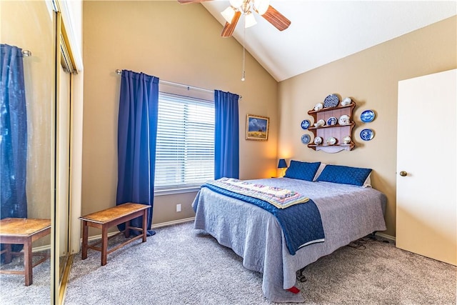 carpeted bedroom with ceiling fan and high vaulted ceiling